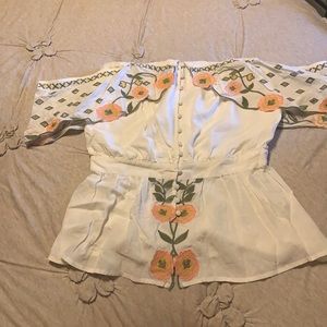 Gimmicks off the shoulder top